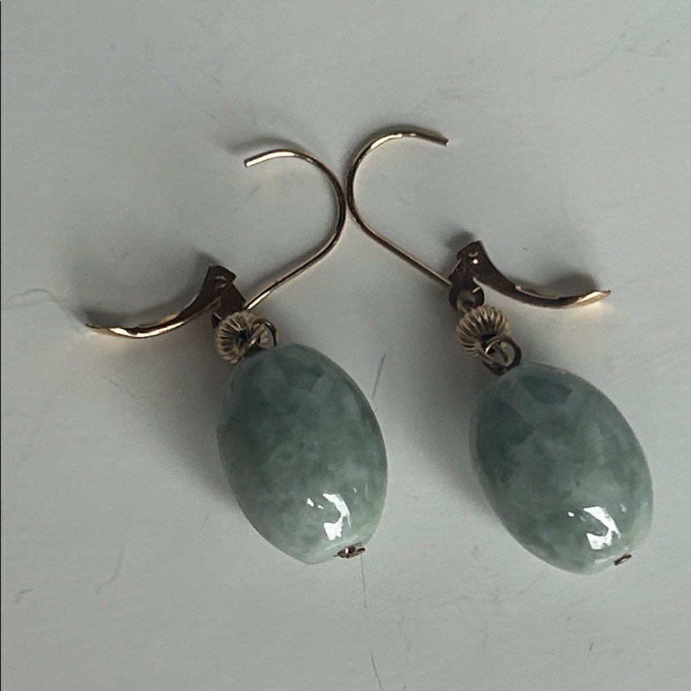 Gold tone hook and heavy stone gray/green mottled stones. Gorgeous!